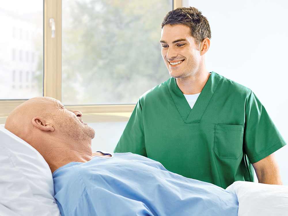 nurse and patient talking at the bedside