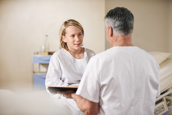 patuent boy with pediatric nurse on ward