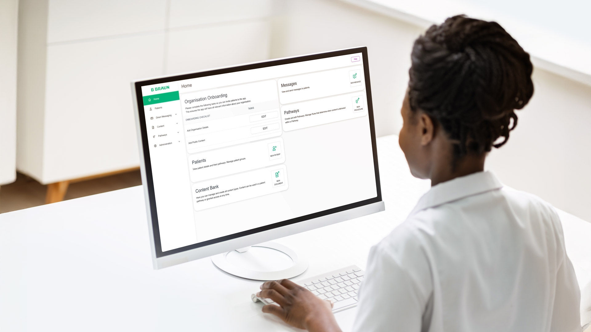 Woman in front of a desktop monitor with the ForPatientApp screen